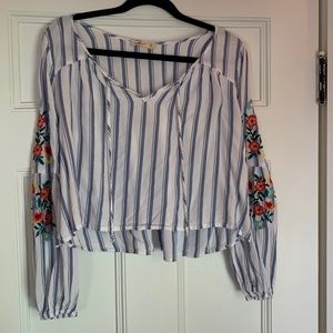 Hollister size S flowy shirt with sewn in flower designs on sleeves
